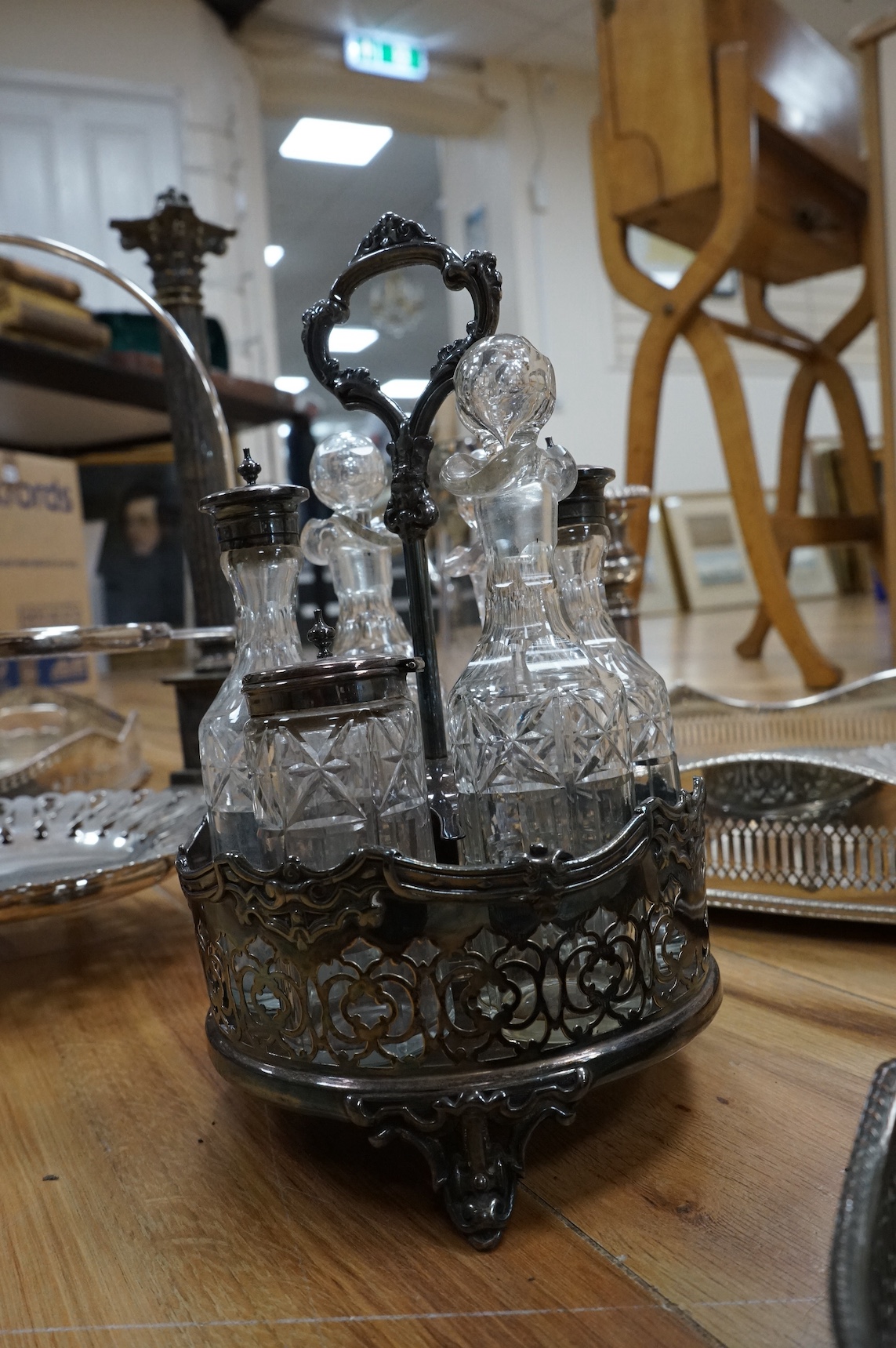 A collection of various silver plated wares including an Art Nouveau claret jug, trays, Corinthian column table lamp etc. Condition - varies